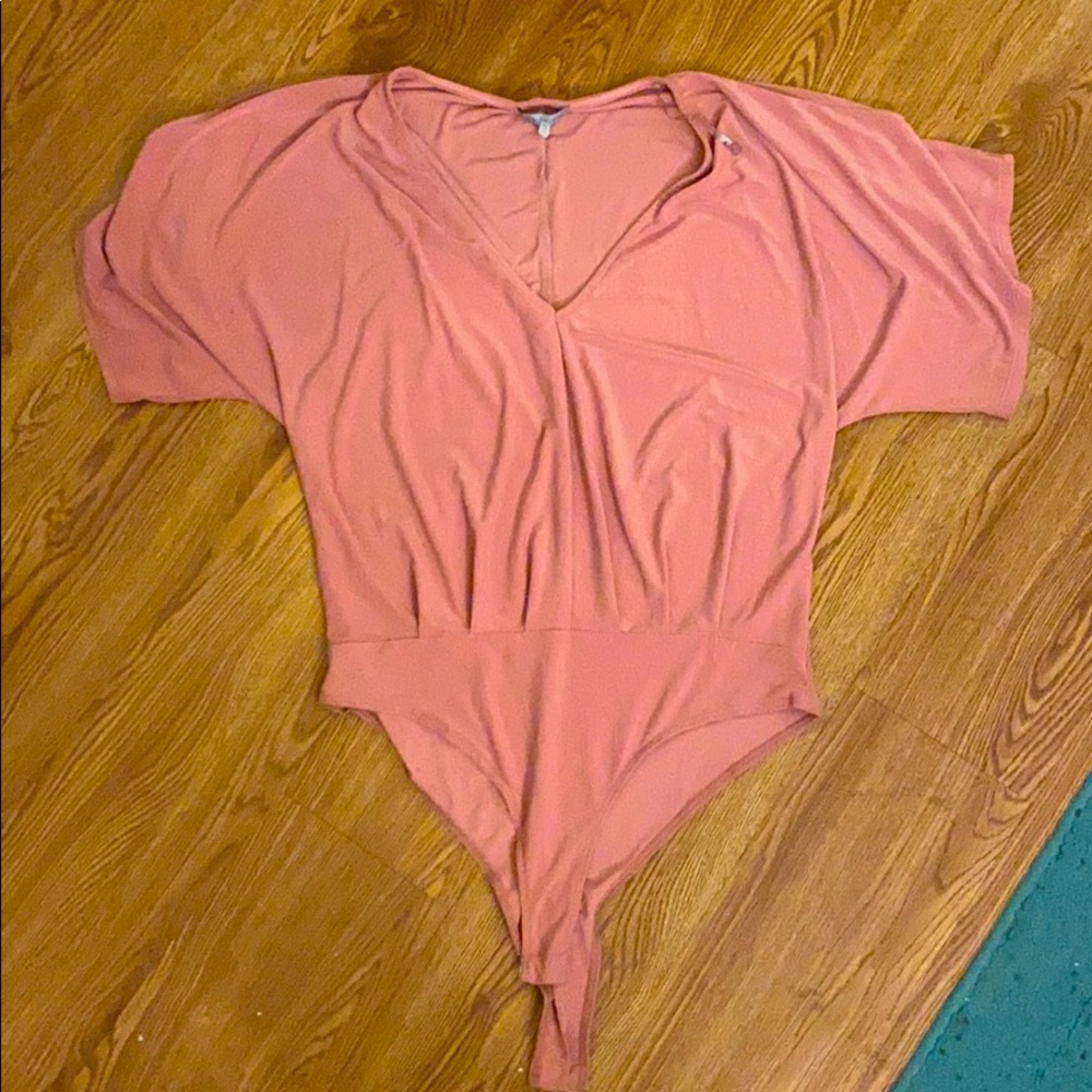 Muted pink ruffle bodysuit